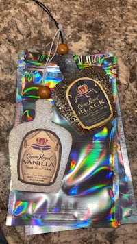 a bottle of liquor sitting on top of a piece of foil